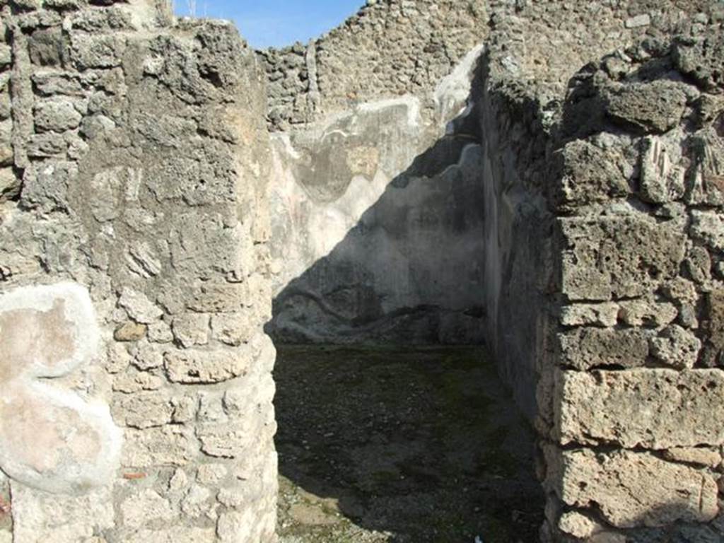V.2.10 Pompeii. December 2007. Doorway to room 5.
According to NdS, this doorway led to a spacious room on a slightly higher level, and which could have been a triclinium.
It was decorated with two paintings, both relative to the myth of Daedalus and Pasiphae.
The one on the east wall, see below, was cut.
Only a trace remained of the one on the west wall.
Straight ahead, Sogliano could see the figure of Pasiphae sitting on a throne and turning to the left.
She was wearing a purple robe fringed with blue.
To the left of her was the outline of a cow, near to which would have been the figure of Daedalus, who would have been almost in the middle.
See Notizie degli Scavi, 1891, p. 269.
See Notizie degli Scavi di Antichità, 1896, p. 437.