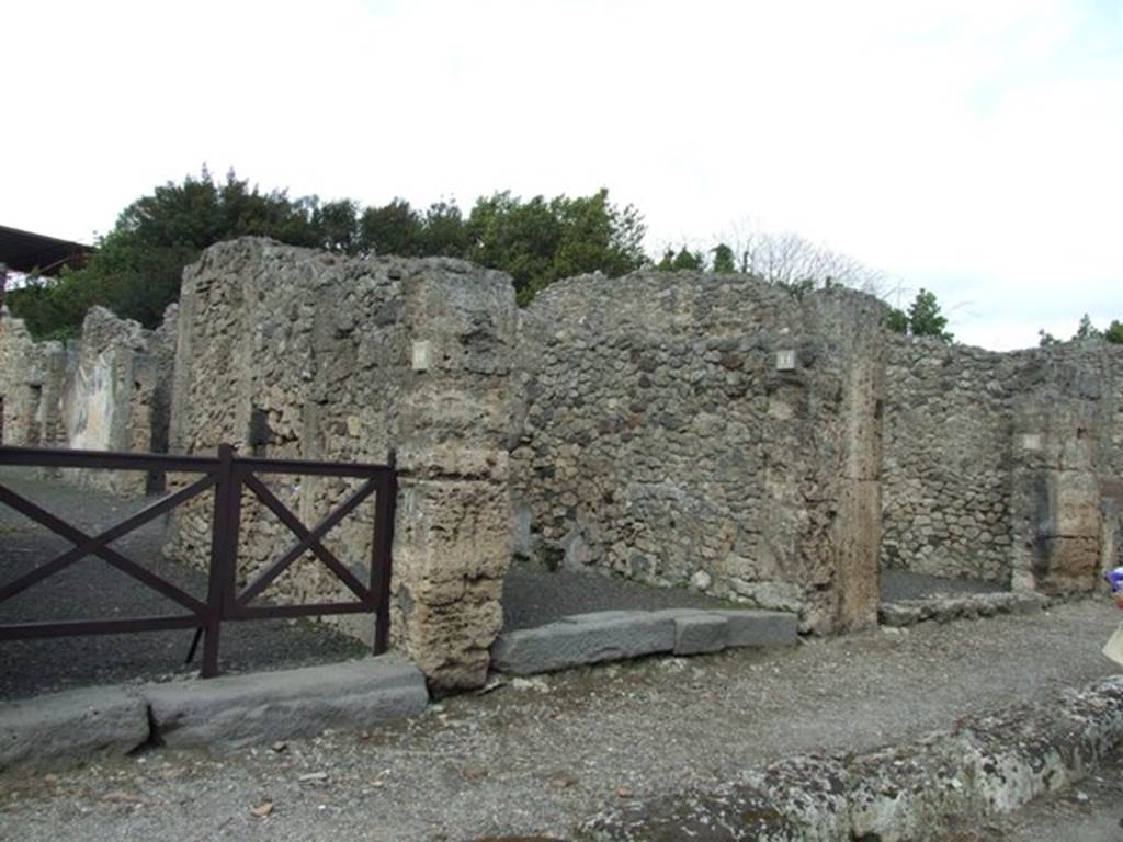 V.2.11 Pompeii. March 2009. Doorways to V.2.10, V.2.11 (centre) and V.2.12, on Via di Nola.
