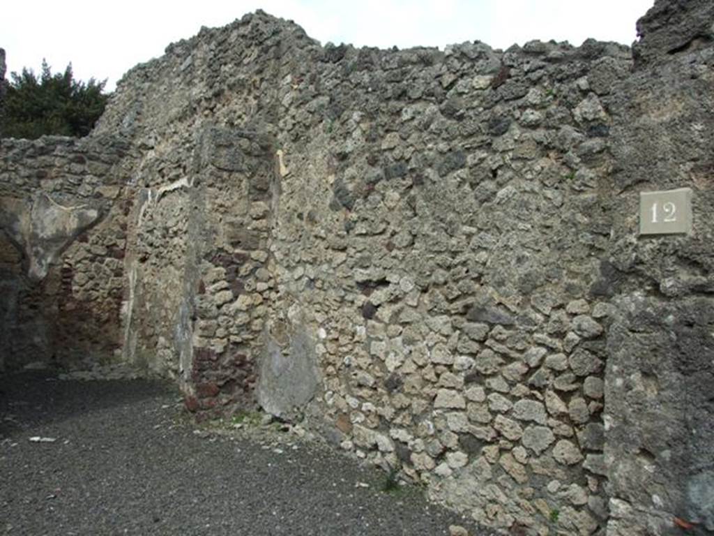 V.2.12 Pompeii. March 2009. East wall of shop, with doorway to rear room and site of stairs to upper floor.