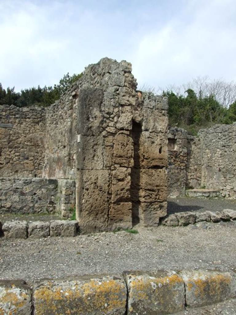 V.2.13 Pompeii, March 2009. Exterior wall between V.2.13 and V.2.14, with channel for downpipe.