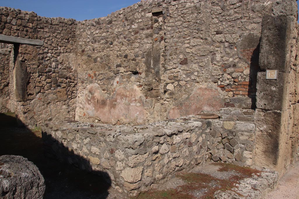 V.2.13 Pompeii. October 2022. Looking across bar-counter towards north-east corner and east wall. Photo courtesy of Klaus Heese.