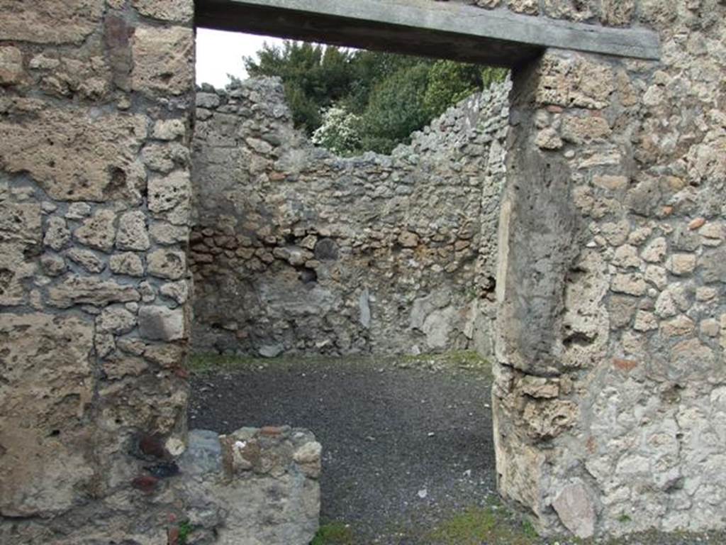 V.2.13 Pompeii. March 2009. Doorway to rear room. According to Mau in BdI, when found this room was painted in the Fourth Style on a white background. It too had an upper room above it, the floor of which would have been at a height of 3.30m. See Mau, A., 1894. Mitteilungen des Kaiserlich Deutschen Archaeologischen Instituts, Roemische Abtheilung Volume VIII. (p.49)
