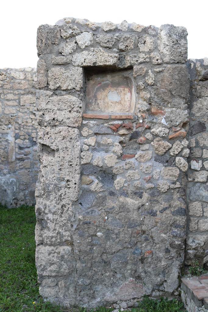 V.2.14 Pompeii. December 2018.
Pilaster with niche Lararium in north wall of shop. Photo courtesy of Aude Durand.