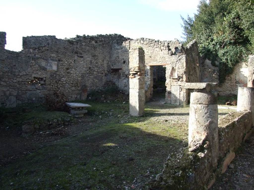 V.2.15 Pompeii. December 2007. Looking north-west across peristyle. According to NdS, in the middle of the peristyle was the area for the flowers. Near the west wall was a masonry triclinium which would have been protected by its own cover, perhaps a pergola. The pergola would have been supported by four columns clad in yellow plaster on which were painted vine leaves and bunches of grapes. The portico only surrounded the peristyle on its north and east sides.