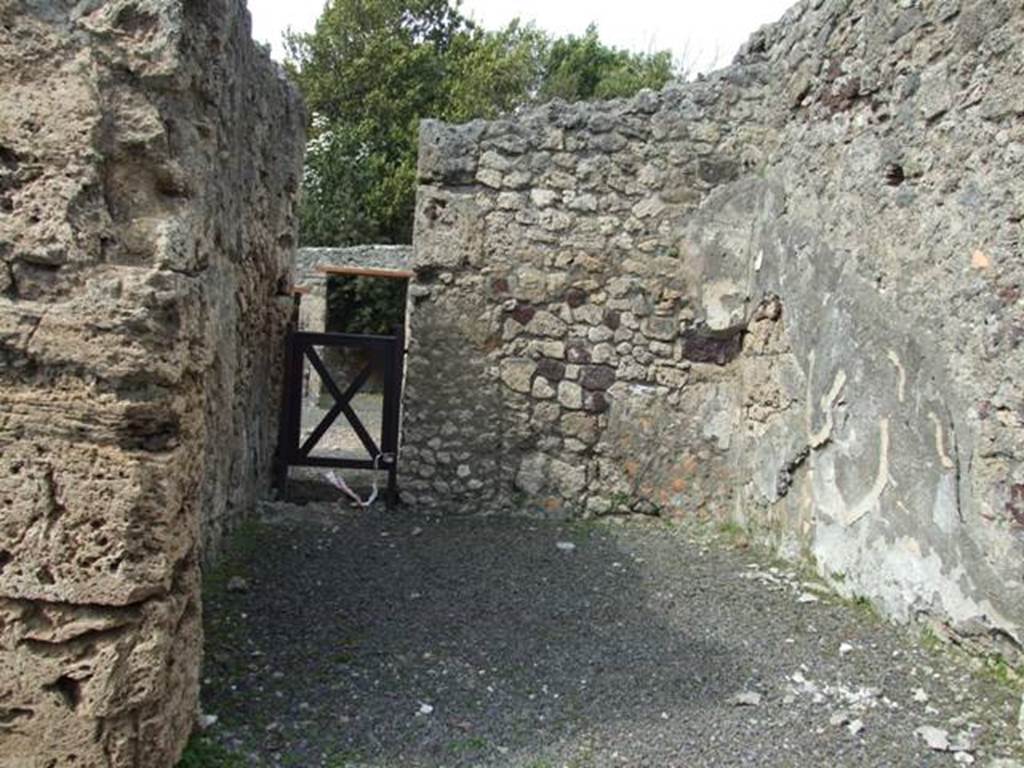V.2.16 Pompeii. March 2009. Looking north across shop. The outline of the wooden stairs can be seen on the east wall.