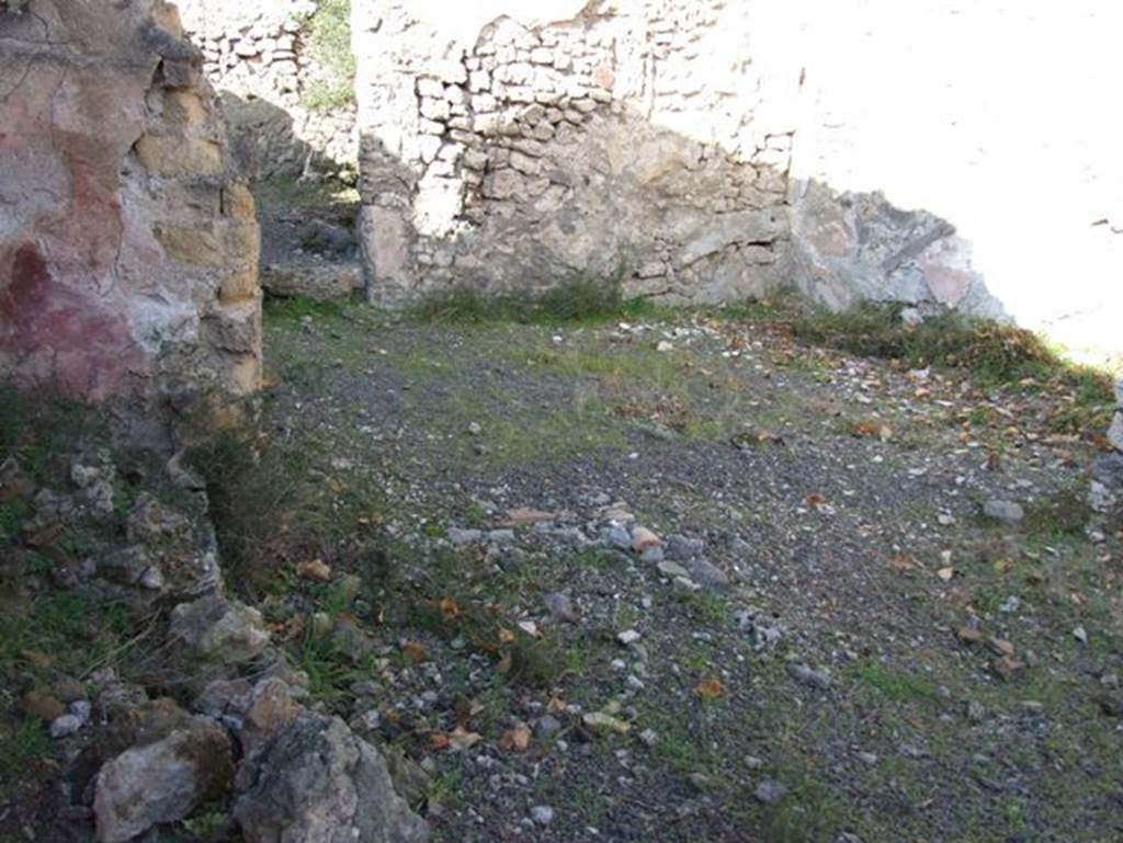 V.2.19 Pompeii. December 2007. Site of doorway to rear room in north wall of thermopolium (across centre of photo). According to Boyce, at the rear of the second room on the east side was an arched structure. Boyce said according to Mau, this may have been a lararium or merely a hearth.
See Boyce G. K., 1937. Corpus of the Lararia of Pompeii. Rome: MAAR 14. (p.35, no.98)
Boyce gives the reference Rom.Mitt., ix, 1894, 58.