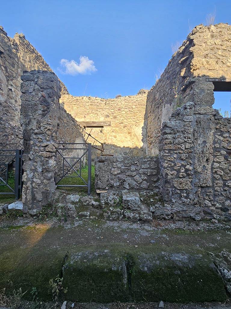 V.2.b Pompeii. November 2024.
Looking east towards entrance doorway to bar-room. Photo courtesy of Annette Haug.