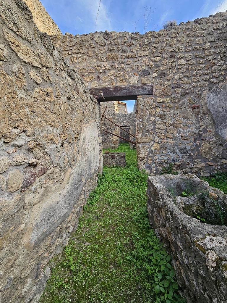 V.2.b Pompeii. November 2024.
Looking east across bar-room towards rear rooms, part of V.2.c. Photo courtesy of Annette Haug.