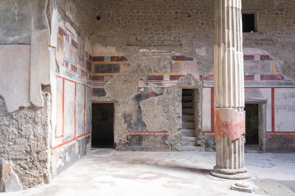V.2.i Pompeii. March 2023.
Room 1, atrium, looking towards north-east corner and doorway to room 3, centre left, stairway, and doorway to room 4, on right.
Photo courtesy of Johannes Eber.