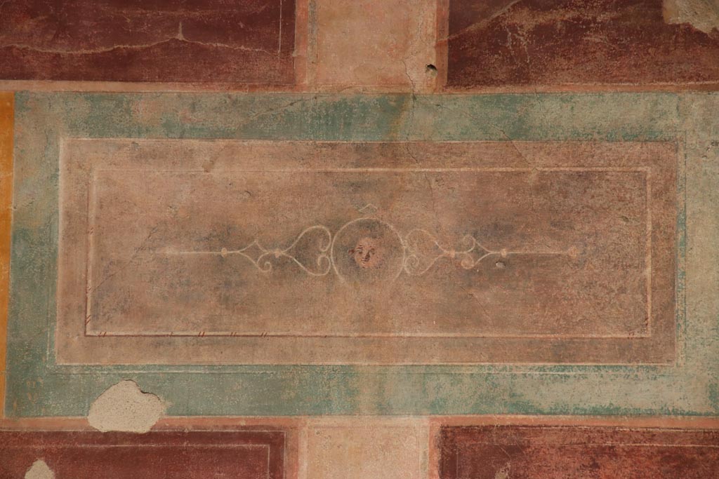 V.2.i Pompeii. October 2023. Room 1, upper east wall above doorway to room 4, detail of painted panel. Photo courtesy of Klaus Heese.