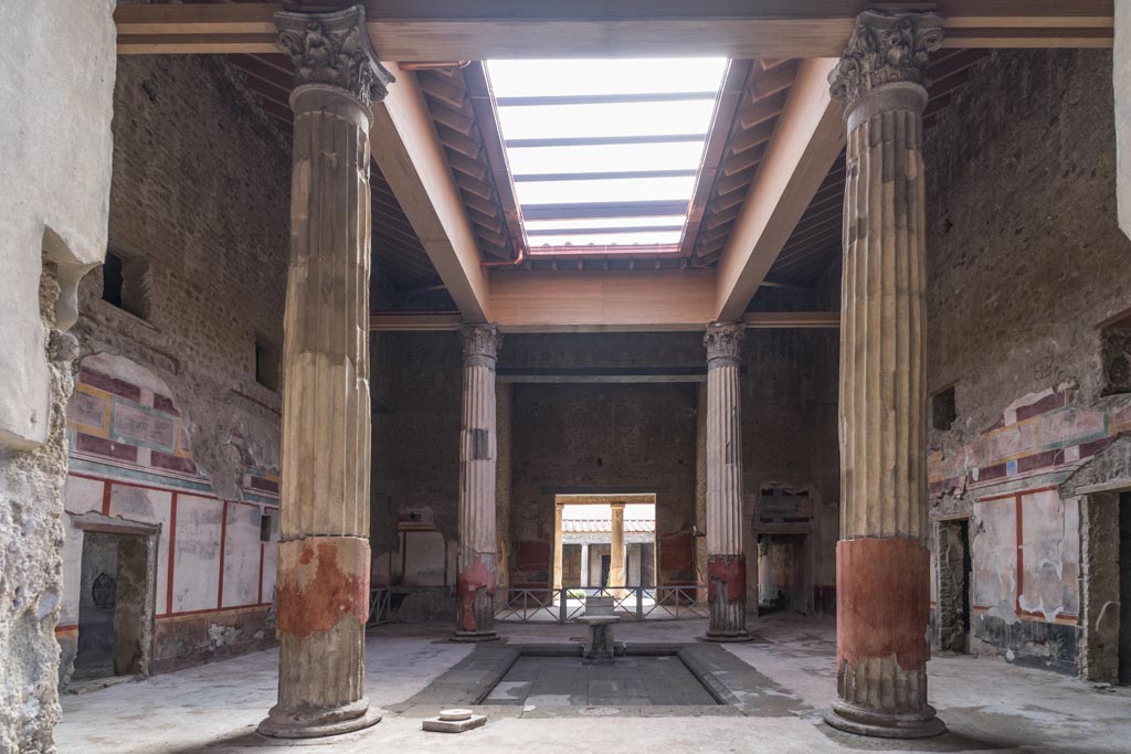 V.2.i Pompeii. March 2023.
Room 1, atrium and impluvium looking south towards tablinum and peristyle. Photo courtesy of Johannes Eber.