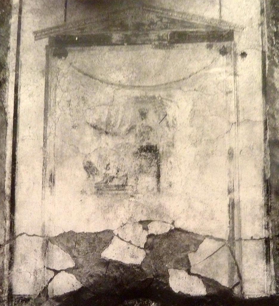 V.2 Pompeii. Casa di Orione. Old undated photograph.
North wall of peristyle garden 11c. Remains of central painting in lararium.
Giove (Jupiter) sits on a throne, his lower body covered with a green robe.
The sceptre is in the left hand, leaning on the arm of the throne.
The lightning bolt is in his outstretched right hand and the eagle at his feet.
See Notizie degli Scavi di Antichità, 1894, p. 439.