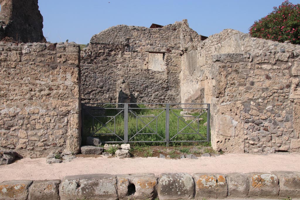 V.3.2 Pompeii. October 2023. Looking towards entrance doorway on north side of Via di Nola. Photo courtesy of Klaus Heese.