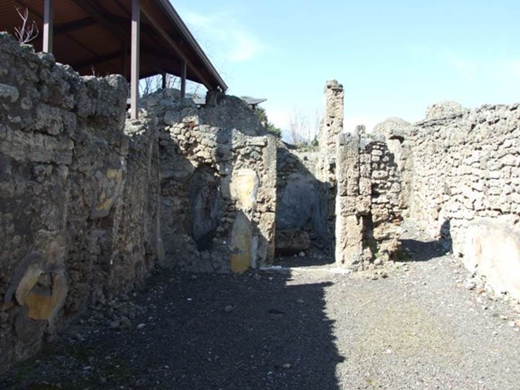 V.3.7 Pompeii. March 2009. Looking north across west side of atrium to Doorway to Triclinium, and passageway to the Garden.