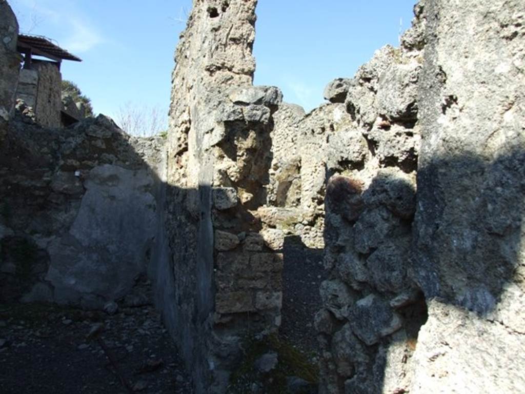V.3.7 Pompeii. March 2009. Triclinium. East wall with door to passageway.