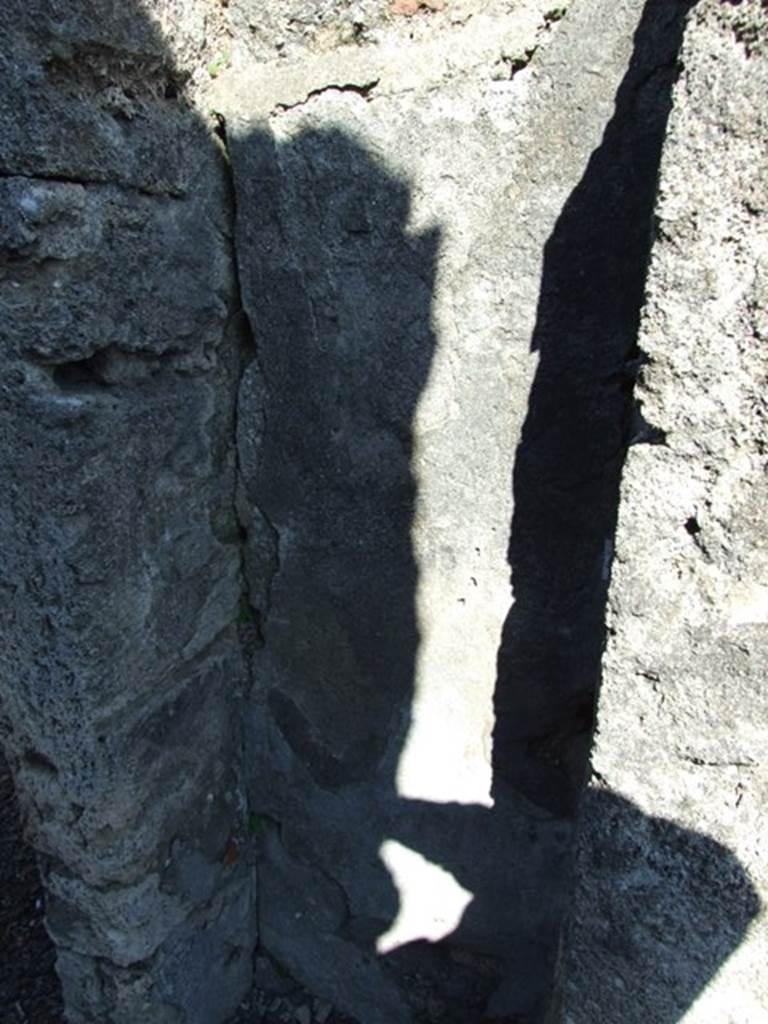 V.3.7 Pompeii. March 2009. Small cupboard in east wall of andron.