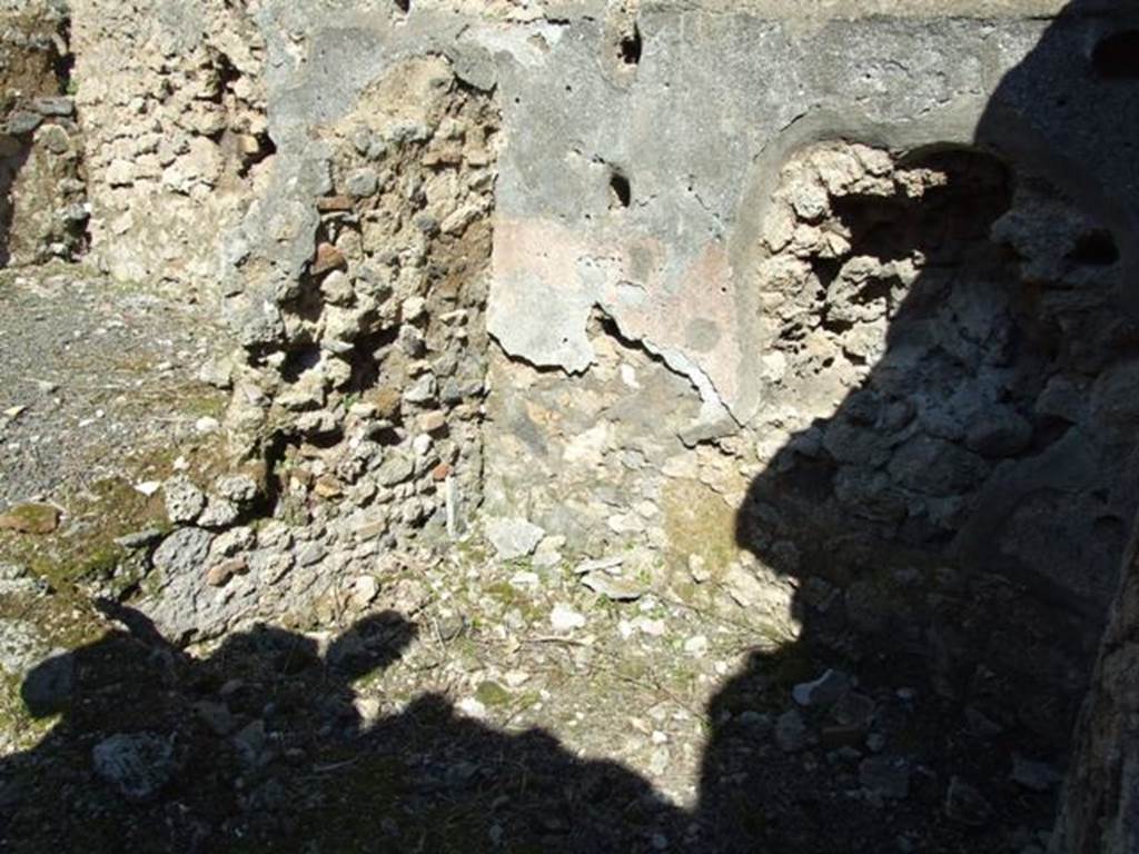 V.3.7 Pompeii. March 2009. Small storeroom on east side of andron, with shelving supports.