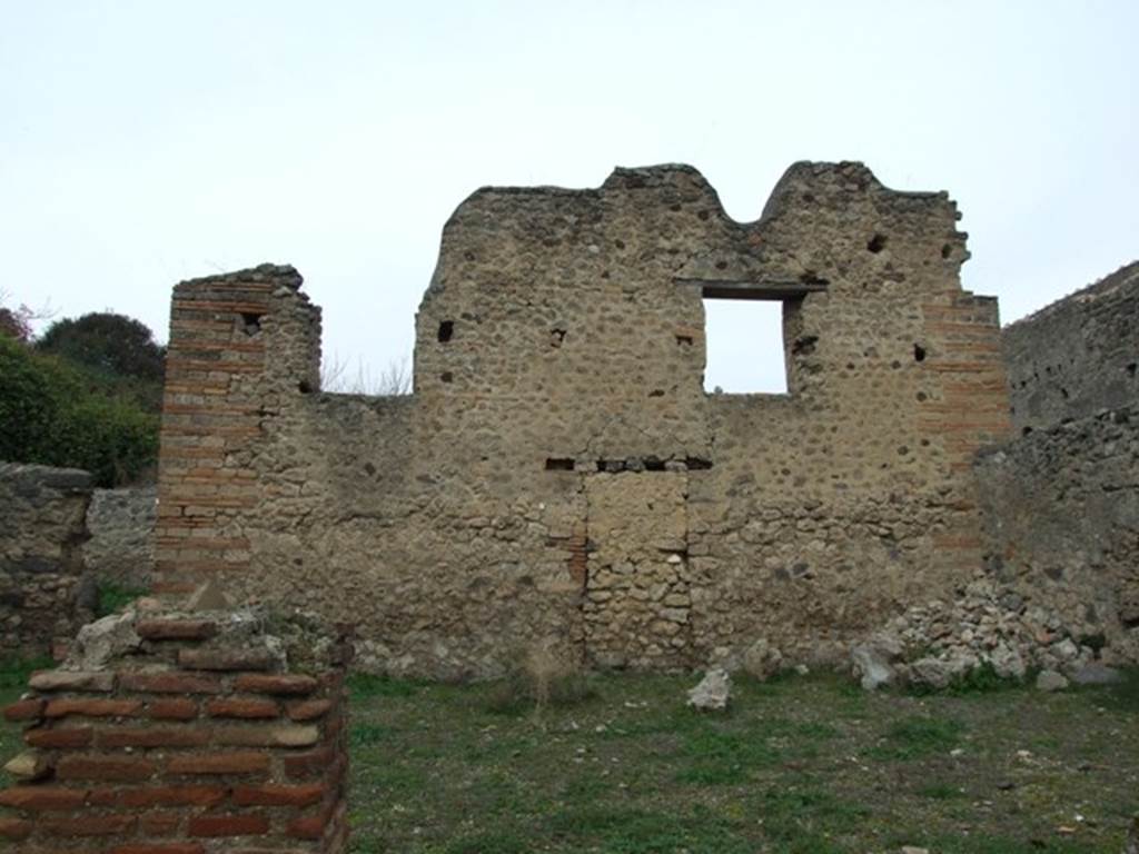 V.3.8 Pompeii. December 2007. North wall of garden (a) with windows and blocked door.