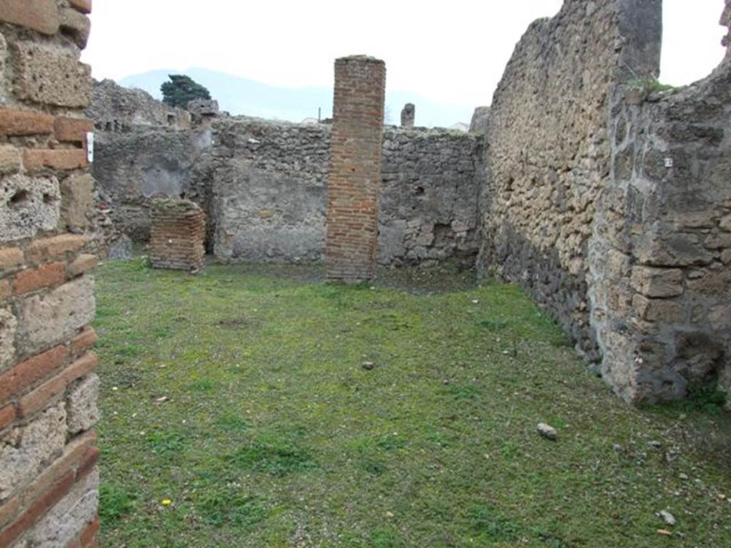 V.3.8 Pompeii. December 2007. Looking south east across area at rear on the north west side, taken from garden (b). Jashemski identifies this as garden (a), which had a portico supported by two brick pillars. See Jashemski, W. F., 1993. The Gardens of Pompeii, Volume II: Appendices. New York: Caratzas. (p.114).