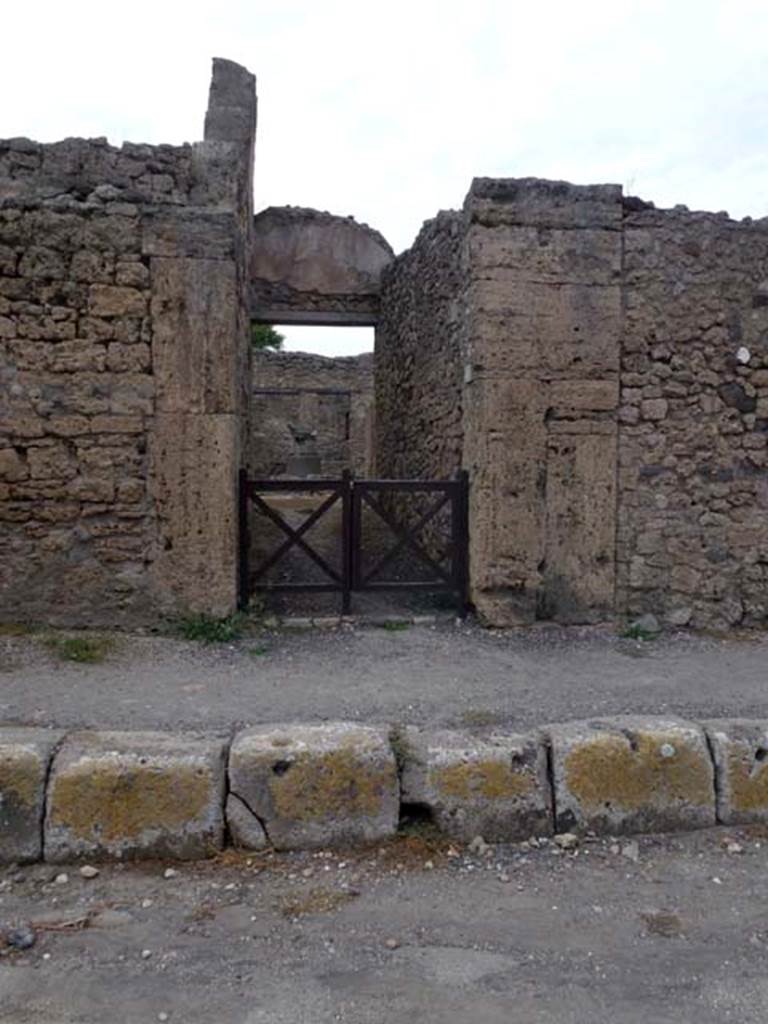 V.3.8 Pompeii. September 2011. Looking north to entrance doorway on Via di Nola.
Photo courtesy of Michael Binns.