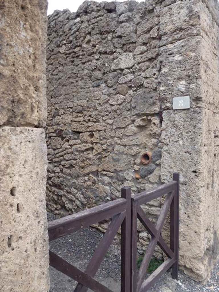 V.3.8 Pompeii. September 2011. East wall of entrance corridor, with hole for a door-lock.
Photo courtesy of Michael Binns.
