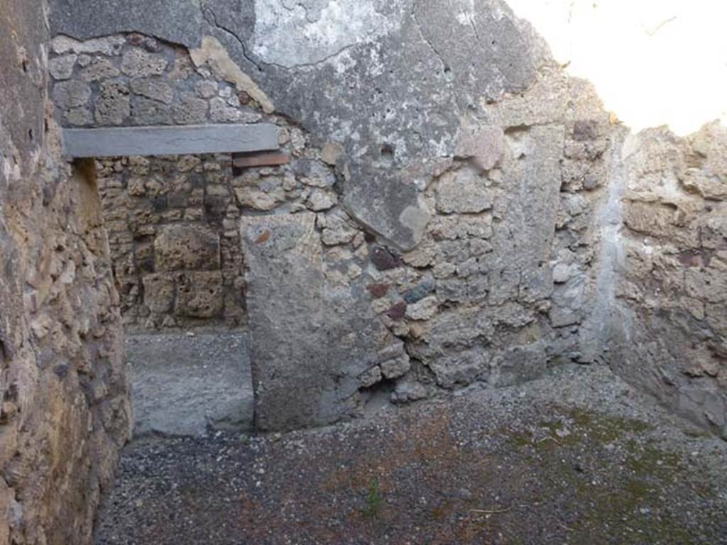 V.3.8 Pompeii. June 2012. East wall of front room on west side of entrance corridor.
Photo courtesy of Michael Binns.