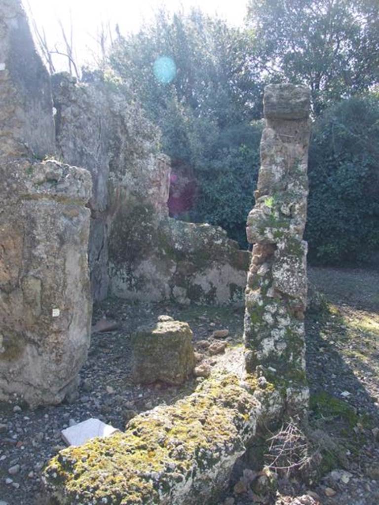 V.3.11 Pompeii. March 2009. Doorway to room in south-west corner of atrium, looking west.
On the right would be the tablinum, which did not have a corridor on either of its sides.
According to NdS, on the left of the tablinum would have been a cubiculum.
This room faced into the kitchen and the garden and was decorated with red and yellow panels with painted birds in the panels.
See Notizie degli Scavi di Antichità, 1902, (p.372)