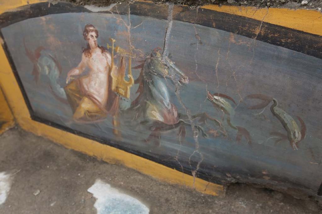 V.3 Pompeii. March 2019. The richly decorated Thermopolium in the open space which acts as a crossroads between Vicolo delle Nozze d’Argento and Vicolo dei Balconi. 
On one side, the decorations on the counter depict the beautiful figure of a Nereid on horseback in a marine environment.

V.3 Pompei. Marzo 2019. Termopolio all'incrocio tra il Vicolo delle Nozze d'Argento e il Vicolo dei Balconi.
Le decorazioni del bancone raffigurano su un lato, una bella figura di Nereide su cavallo in ambiente marina. 

Photograph © of Parco Archeologico di Pompei.
