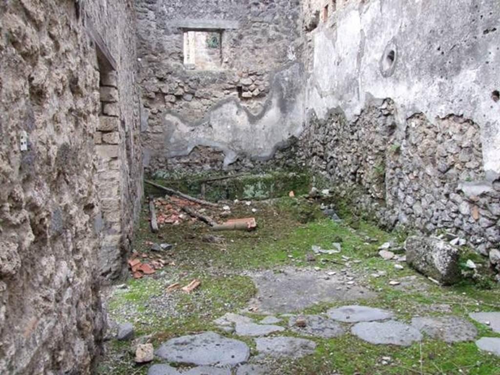 V.4.1 Pompeii. December 2007. Looking west in room “P” to rear of bakery area.
According to NdS,
“A small excavation was carried out on 13th January 1910 in the presence of Lady Aberdeen, Vice-regent of Ireland and her entourage, in the small rustic room at the rear of the house at V.4.1 on the Via di Nola.
Other than many terracotta items of no value, a bronze bucket of oval shape was found, 0.28m high, with a wide mouth and arched moveable handles of iron, broken and restored by the ancients by means of coarse lead solders (Inv.100).”
See Notizie degli Scavi, 1910, p. 331.
