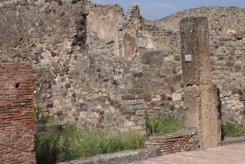 V.4.2 Pompeii. October 2023.
Looking towards east wall from entrance doorway, and side doorway into V.4.3. Photo courtesy of Klaus Heese.