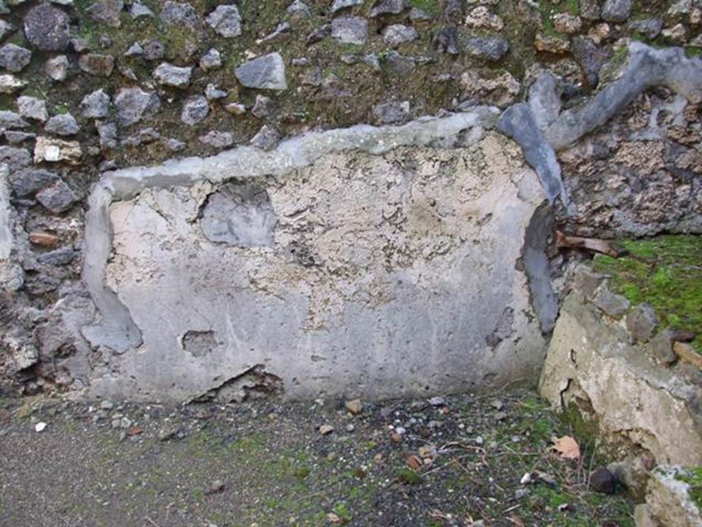 V.4.3 Pompeii.  March 2009. East wall of Kitchen.  Site of Lararium painting, which had three zones, now faded and destroyed. See Fr�hlich, T., 1991. Lararien und Fassadenbilder in den Vesuvst�dten. Mainz: von Zabern. L53 on p.272. See Giacobello, F., 2008. Larari Pompeiani: Iconografia e culto dei Lari in ambito domestico.  Milano: LED Edizioni, p.169.  See Boyce G. K., 1937. Corpus of the Lararia of Pompeii. Rome: MAAR 14.  (119b).