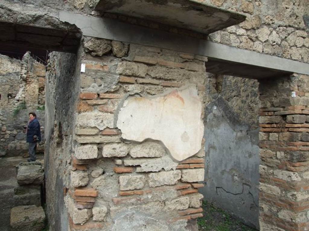 V.4.7 Pompeii. December 2007. Remains of painted wall plaster on north wall pilaster.