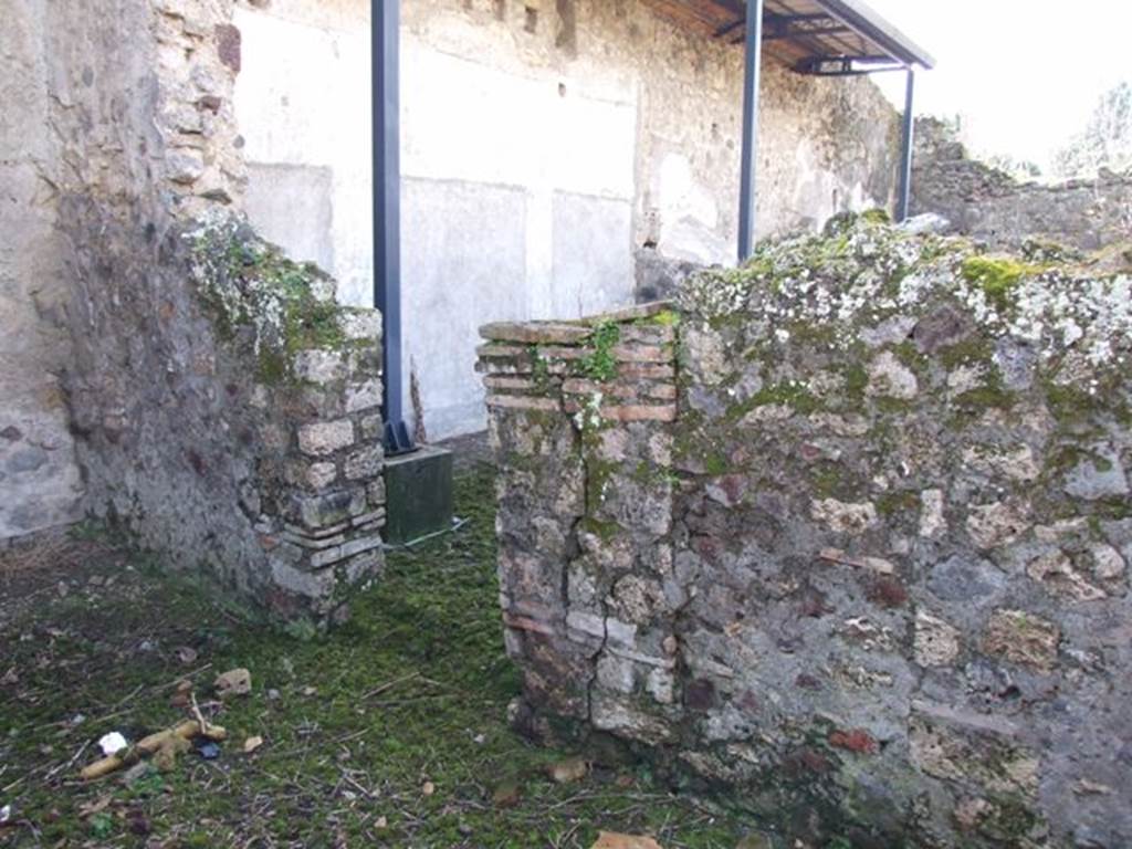 V.4.12 Pompeii. March 2009. West wall, with doorway to Triclinium of V.4.13.