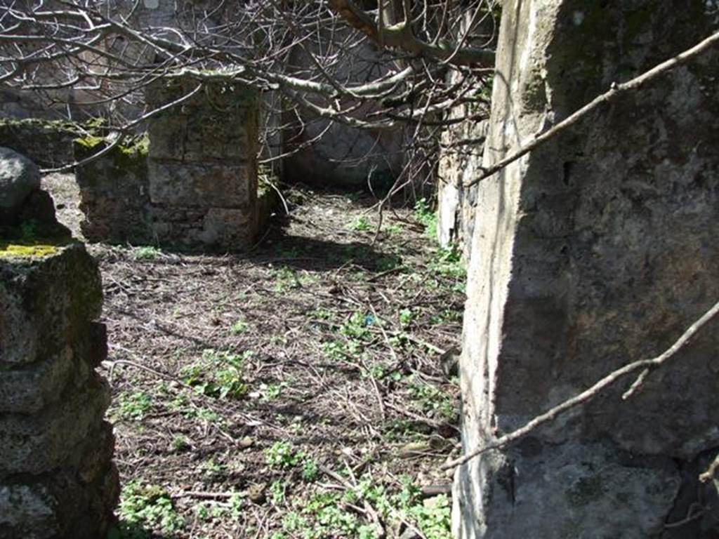 V.4.13 Pompeii. March 2009. Door on west wall of atrium or light yard, leading intoTablinum.