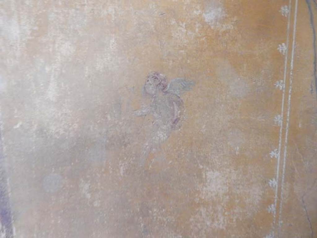 V.4.a Pompeii. May 2015. Room ‘i’, detail of figure on south end of east wall of cubiculum. Photo courtesy of Buzz Ferebee.