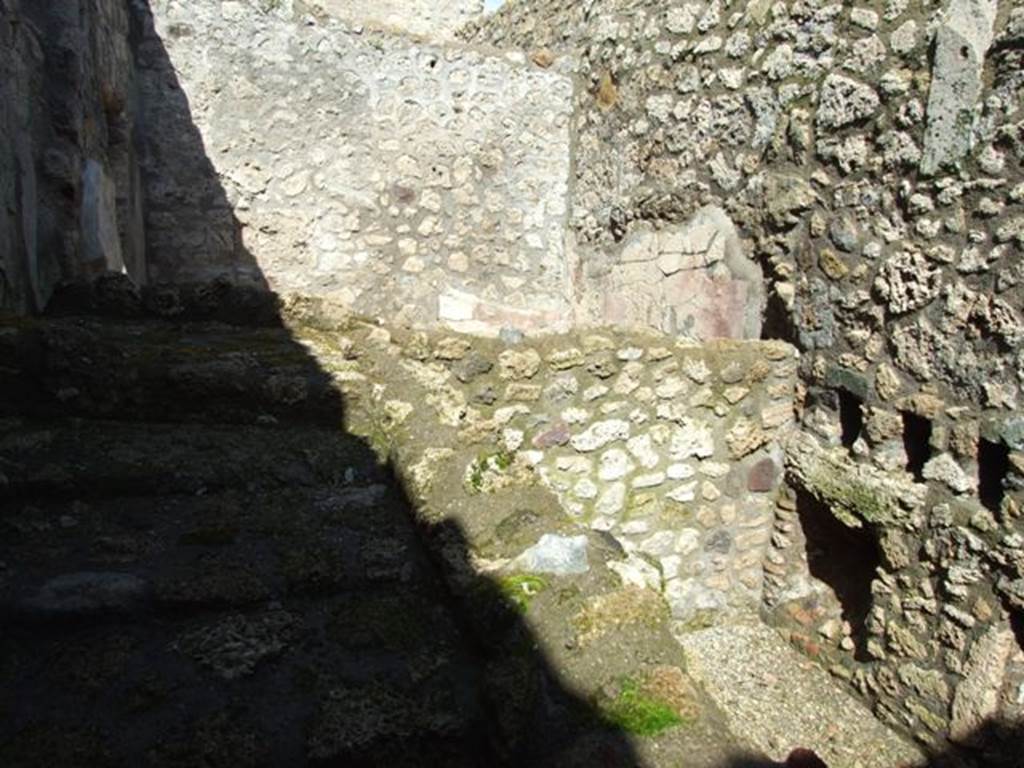 V.5.3 Pompeii. March 2009. Room 3. Staircase to upper floor. Looking north to Room 4, over the wall, and to north and east wall of rear room.