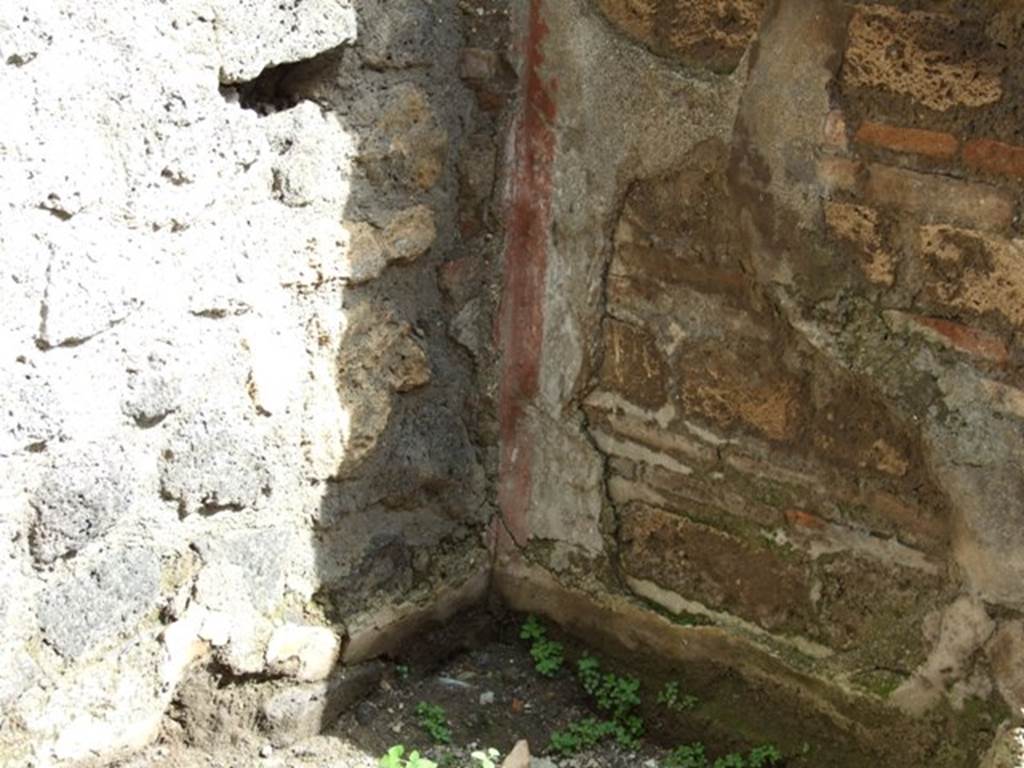 V.5.4 Pompeii. March 2009. Remains of plaster in south east corner of shop.