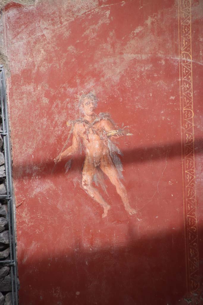 V.6.12 Pompeii. October 2020. Amb. 25. Atrium, red panel with flying figure. Photo courtesy of Klaus Heese.
