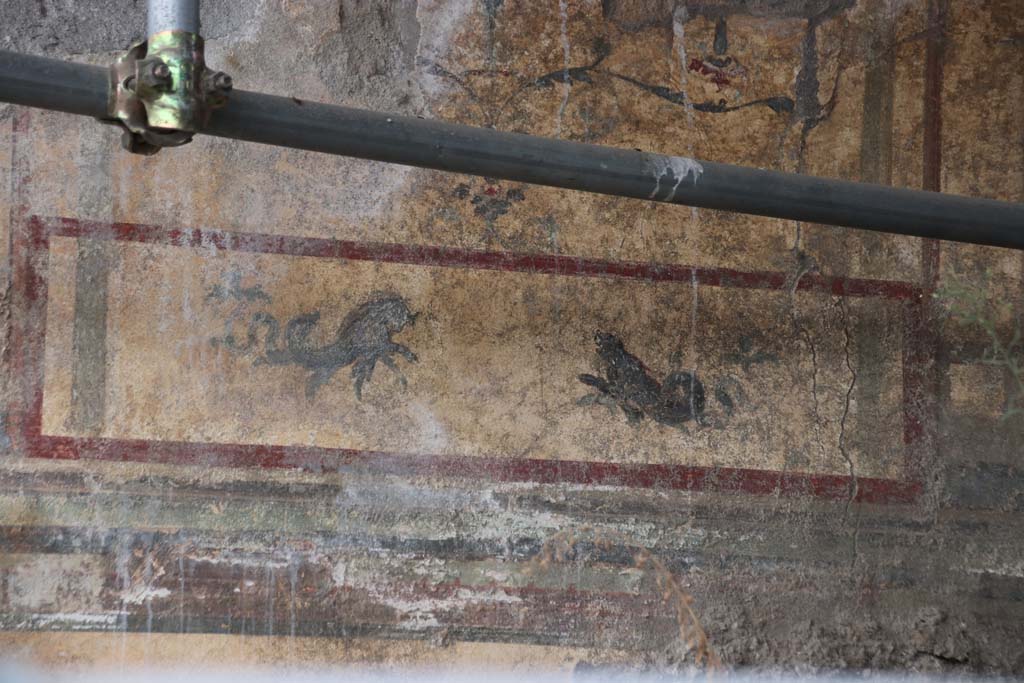 V.6.13 Pompeii, October 2020. Looking towards painted decoration on north wall, photo taken from V.6.12. Photo courtesy of Klaus Heese.