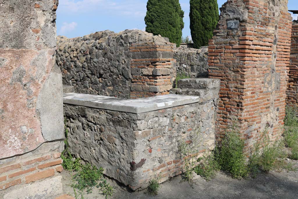 VI.1.2 Pompeii. December 2018.
Looking towards counter on south side of entrance doorway. Photo courtesy of Aude Durand.