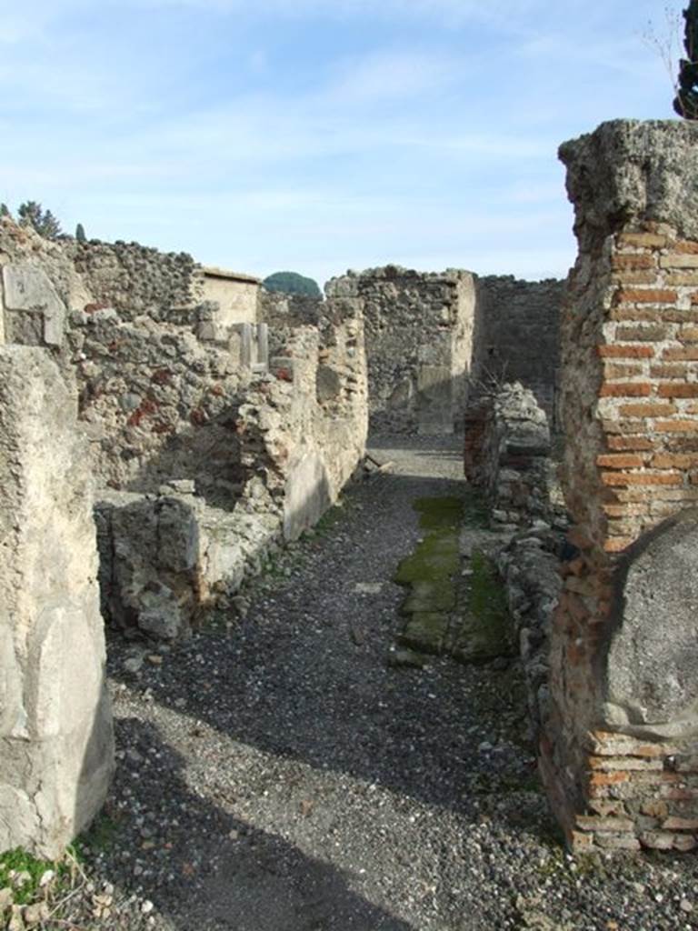 VI.1.7 Pompeii. December 2007. Room 40, corridor. Looking east past entrances to rooms 3, and 39, on the left, towards room 36 at the far end.