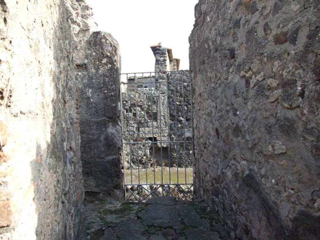 VI.1.10 Pompeii. December 2007. Looking out through rear doorway of house at VI.1.23.