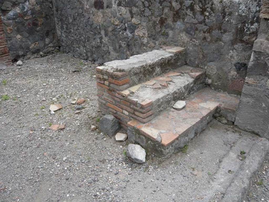 VI.1.15 Pompeii. May 2012. Looking towards masonry steps in south-west corner near entrance. Photo courtesy of Buzz Ferebee.
