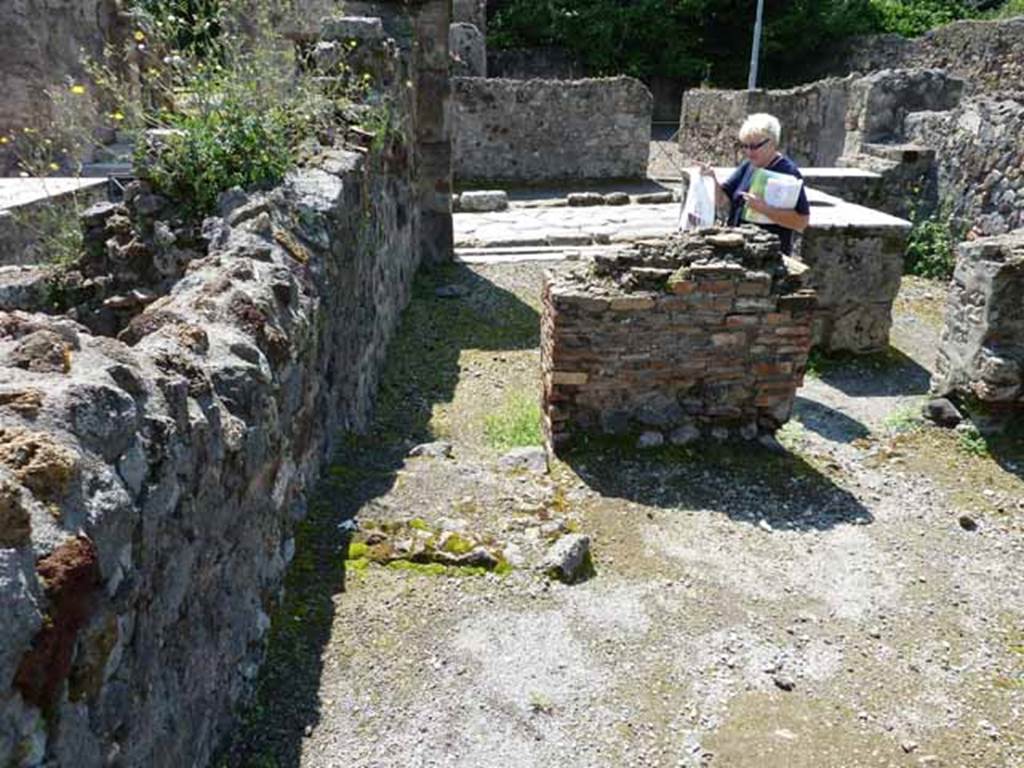 VI.1.17 Pompeii. May 2010. Looking west across bar towards Via Consolare
In the rear room, the remains of the steps to upper floor can be seen on the left.