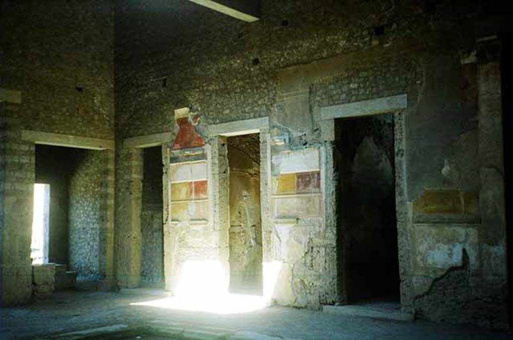 VI.2.4 Pompeii. June 2010. North side of atrium, looking west. Photo courtesy of Rick Bauer. On the left is the entrance to VI.2.5, then the doorway leading to the anteroom of the winter triclinium, see below.
In the centre and on the right, are two doorways to cubicula.