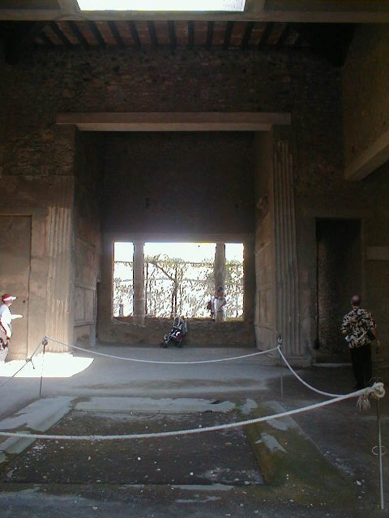 VI.2.4 Pompeii. September 2004. Looking east across atrium and impluvium.
Apart from the west side, the house was entirely destroyed by the bombing during the night of 14/15th September 1943. According to Laidlaw, the roof, the south apartment, and the portico behind the main house block are almost completely modern reconstructions made in 1970-71. See Garcia y Garcia, L., 2006. Danni di guerra a Pompei. Rome: L’Erma di Bretschneider. (p. 66-74)