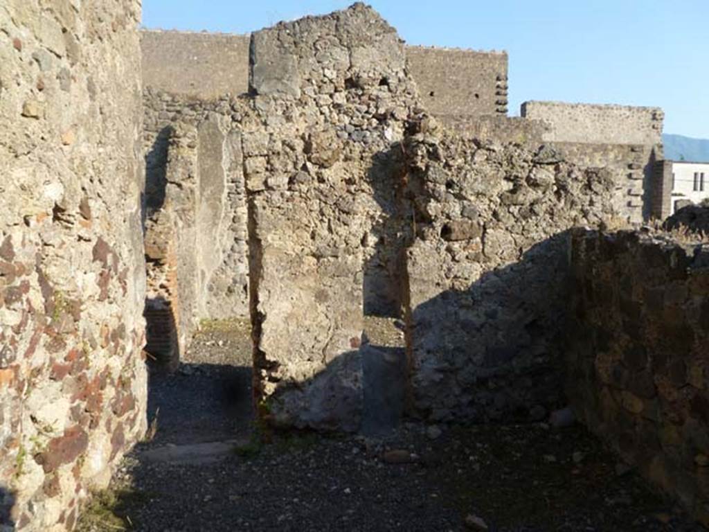 VI.2.7 Pompeii. May 2011. Looking south towards doorway of room on north side of corridor. Photo courtesy of Michael Binns.