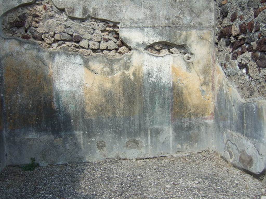 VI.2.16 Pompeii. September 2005. North wall of room on north side of peristyle.
According to PPM –
“The north wall was preserved up until the curve of the vaulted ceiling, which was marked by a cornice of stucco, now lost.
The wall was painted in the IV Style in a scheme with a symmetrical structure, with (yellow?) zoccolo subdivided into panels and compartments, and a yellow middle zone, with panels separated by architecture.
Probably in this room the vignettes of Cupids, as drawn by Zahn, were to be found, (Helbig 649 and 699b).
The upper zone of the wall was white.”
See Carratelli, G. P., 1990-2003. Pompei: Pitture e Mosaici. IV. Roma: Istituto della enciclopedia italiana, p. 202.
See Zahn, W., 1828. Die schönsten Ornamente und merkwürdigsten Gemälde aus Pompeji, Herkulanum und Stabiae: I. Berlin: Reimer, taf. 74.
See Helbig, W., 1868. Wandgemälde der vom Vesuv verschütteten Städte Campaniens. Leipzig: Breitkopf und Härtel, (nos. 649 and 699b).