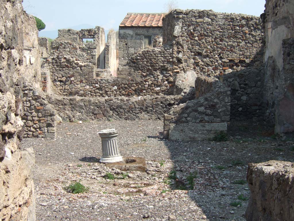 VI.2.17 Pompeii. September 2005. Looking east across atrium with impluvium, towards tablinum.
For photos of the east part of this linked house, see VI.2.20.
According to Garcia y Garcia, in this house much damage was caused by the two bombs that fell on the nearby house to the north.
After the bombardment, it was left in a state of grave abandonment.
See Garcia y Garcia, L., 2006. Danni di guerra a Pompei. Rome: L’Erma di Bretschneider. (p.74).