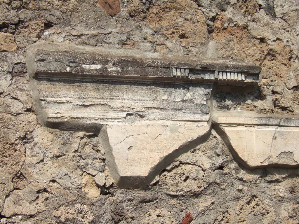 VI.2.17 Pompeii. September 2005. Remains of cornice and plaster from north wall of tablinum.